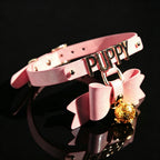 WILDCHOK Pink Glitter TPU Choker | Bow, LED Bell & Metal Letter Decor