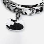 WILDCHOK Black‑White Cow Print O‑Ring Choker | Adjustable PU Leather Necklace with Cat‑Head Charm