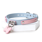WILDCHOK Pink‑Blue Two‑Tone Cowhide Choker, Adjustable Necklace with Bone Charm & Bell